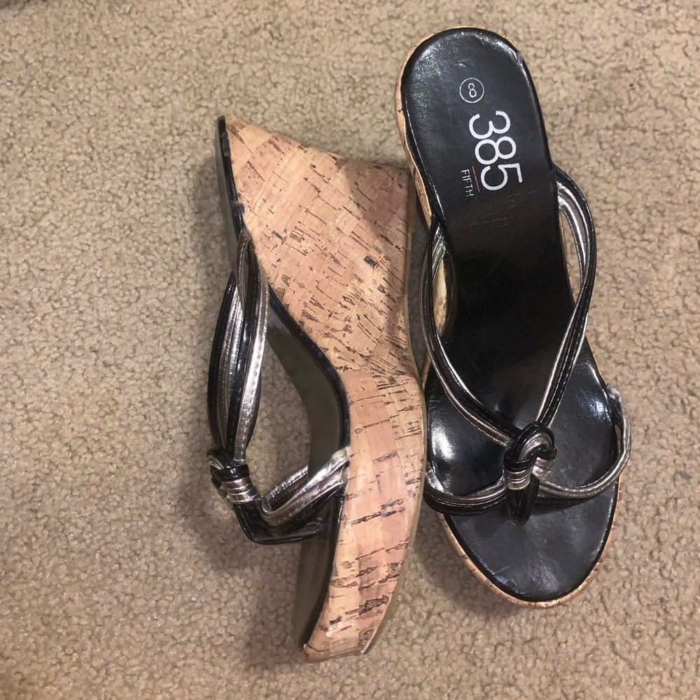 385 fifth Black flip flop wedges.